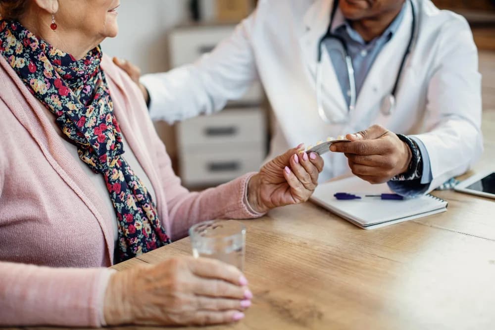 A nurse going through a client's medication