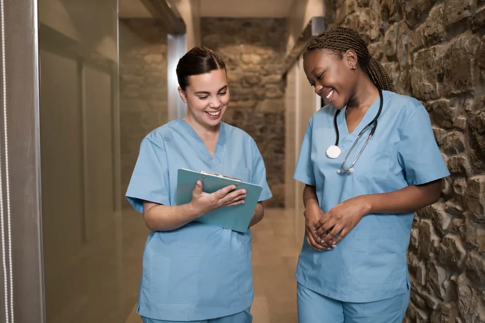 Registered nurses reviewing a client's chart